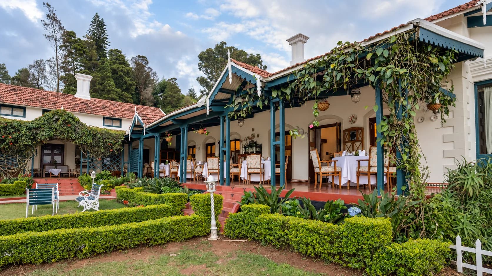 The veranda running the length of the house, with garden chairs