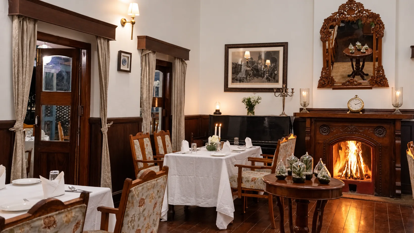 A table set beside the fireplace, its fire lit
