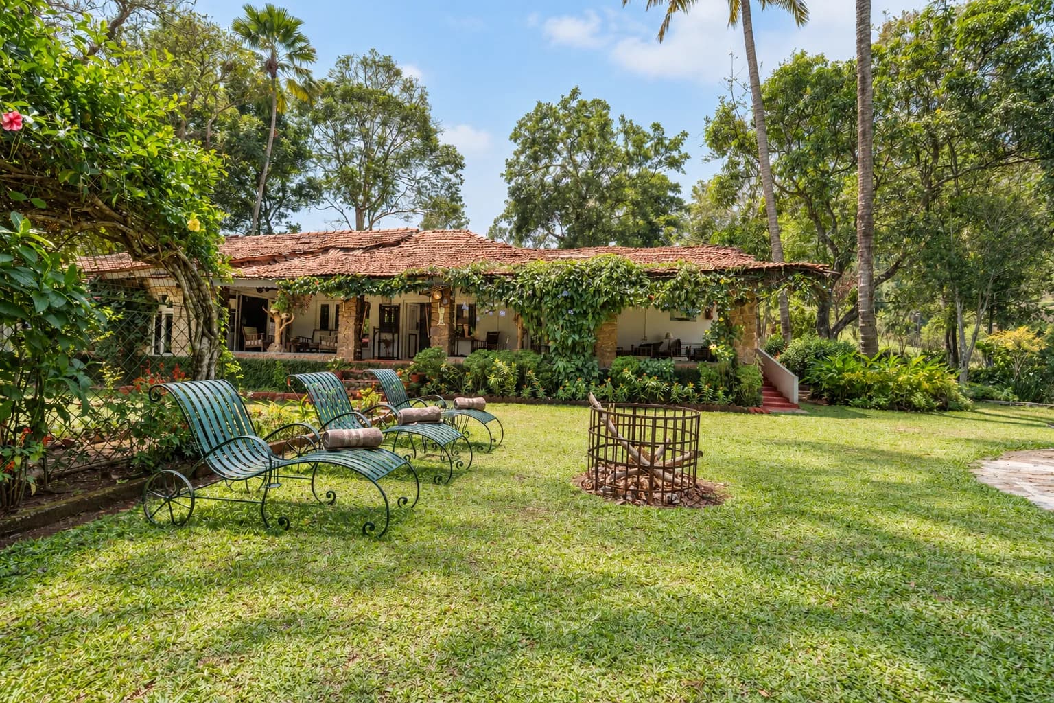The lawn with its garden seating, the house beyond