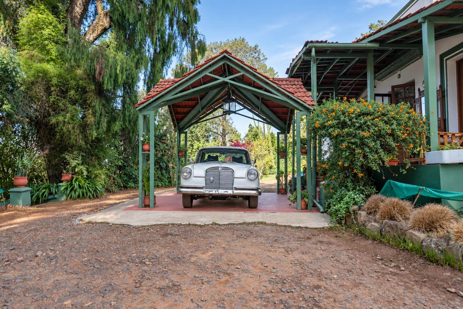 The car porch, a vintage car under its timber roof